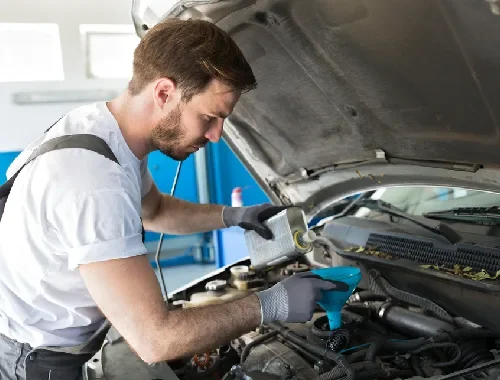 Mechanic carrying out seasonal vehicle checks for Melbourne driving conditions